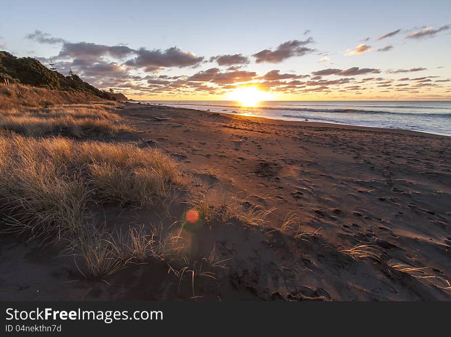 The sun setting at Oakura beach on a winter evening. The sun setting at Oakura beach on a winter evening