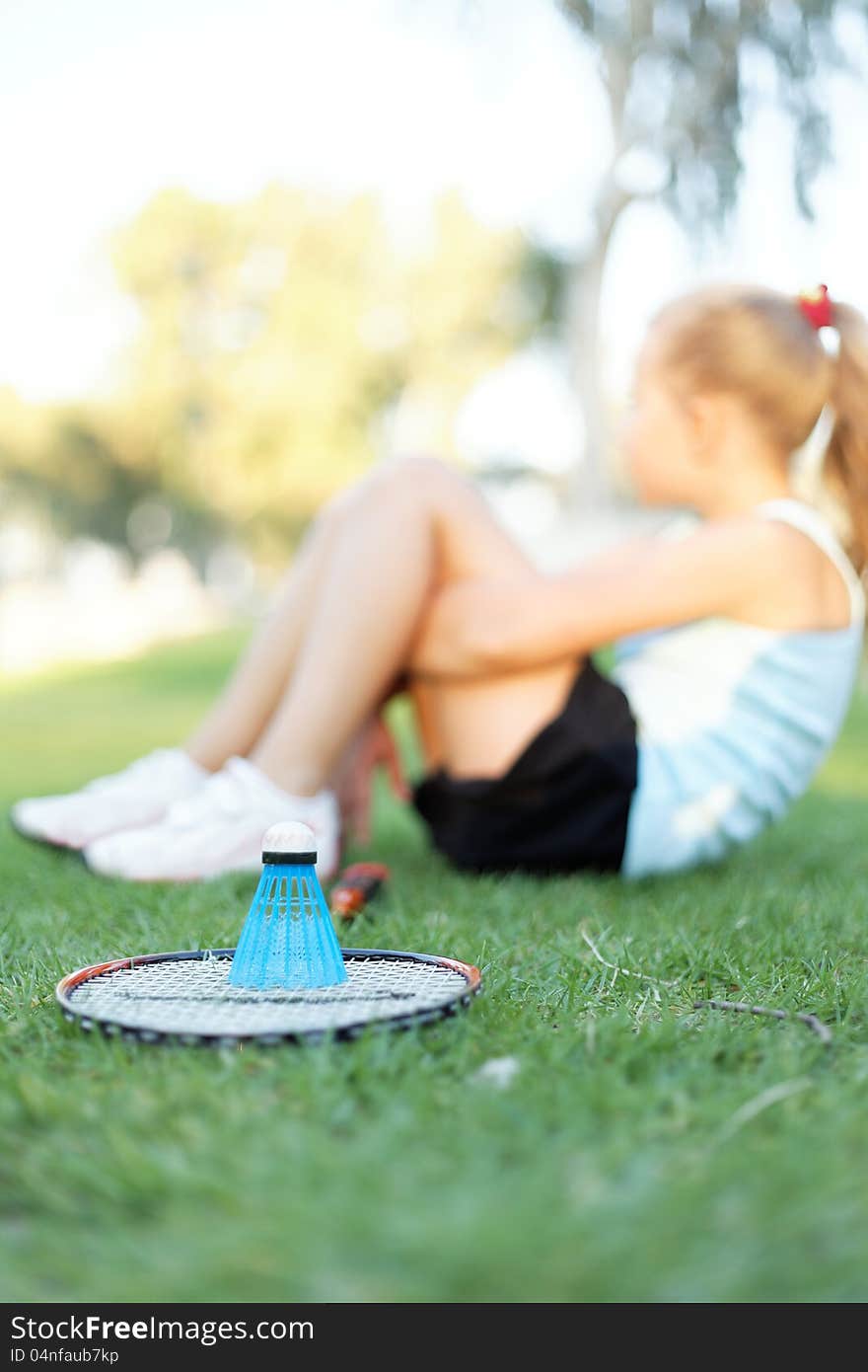 Girl With A Set Of Badminton In The Park