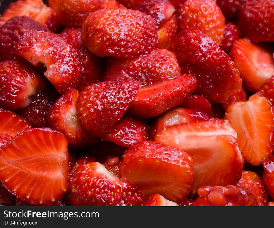 Fresh, sweet, red strawberries cut in halves, ready to be eaten. Fresh, sweet, red strawberries cut in halves, ready to be eaten.