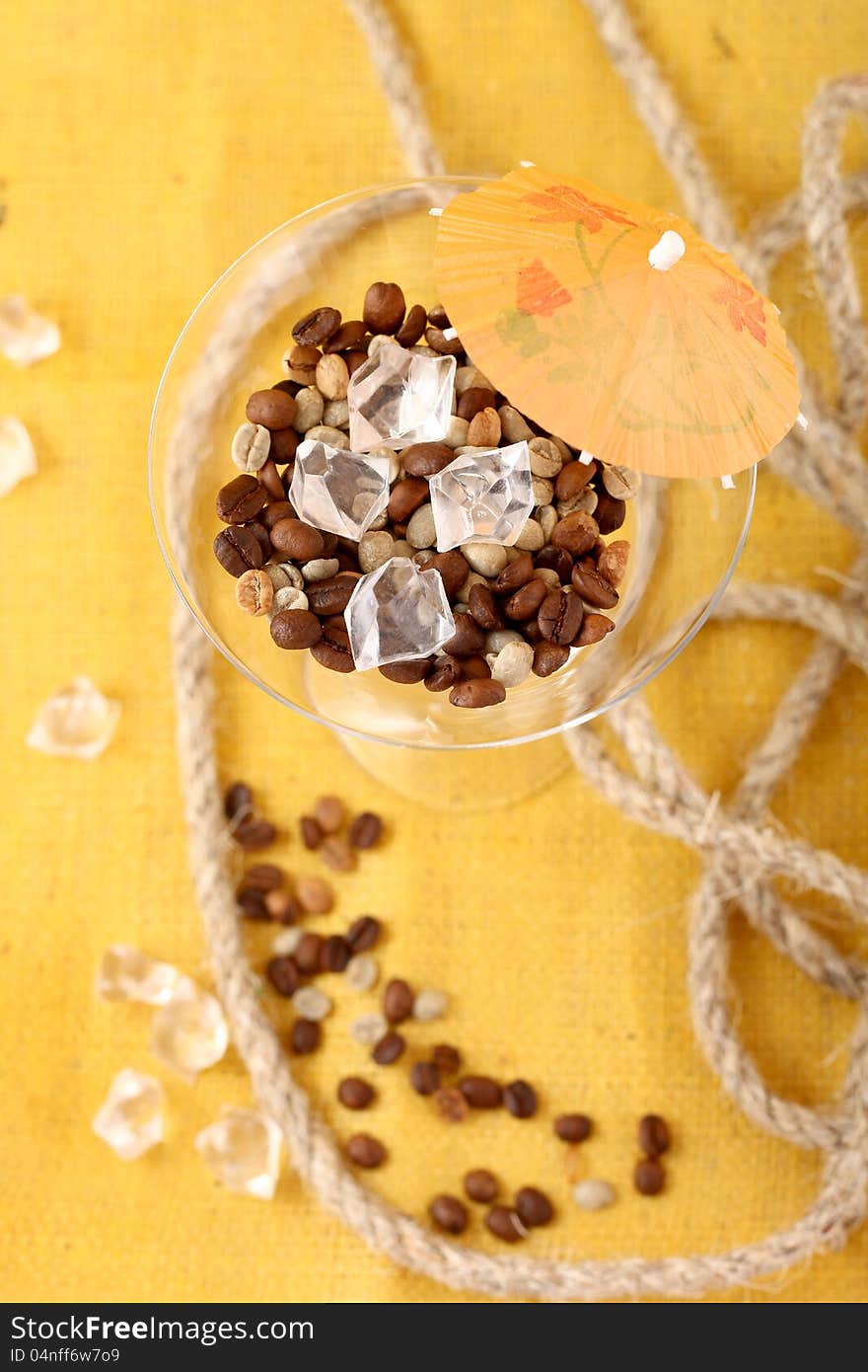 Coffee in a glass on a yellow background. Coffee in a glass on a yellow background