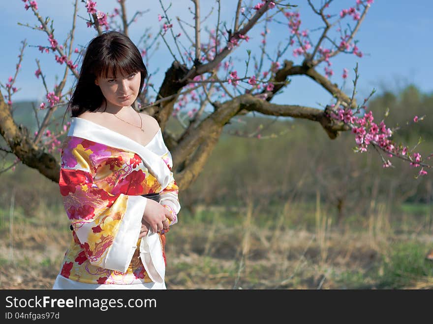 Girl and flowerses of the peach. Girl and flowerses of the peach