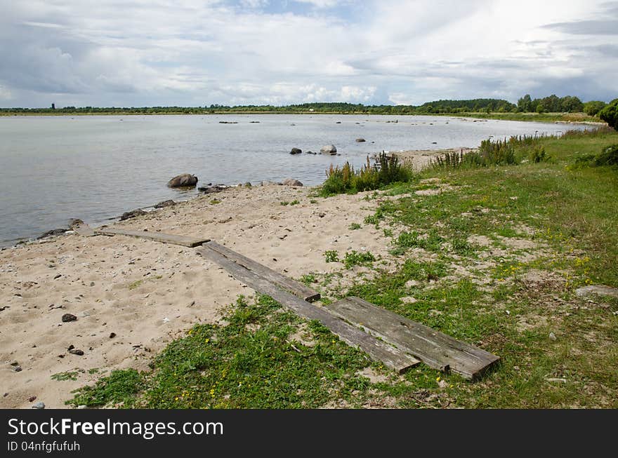 Old weathered wooden footbridge to the beach. Old weathered wooden footbridge to the beach