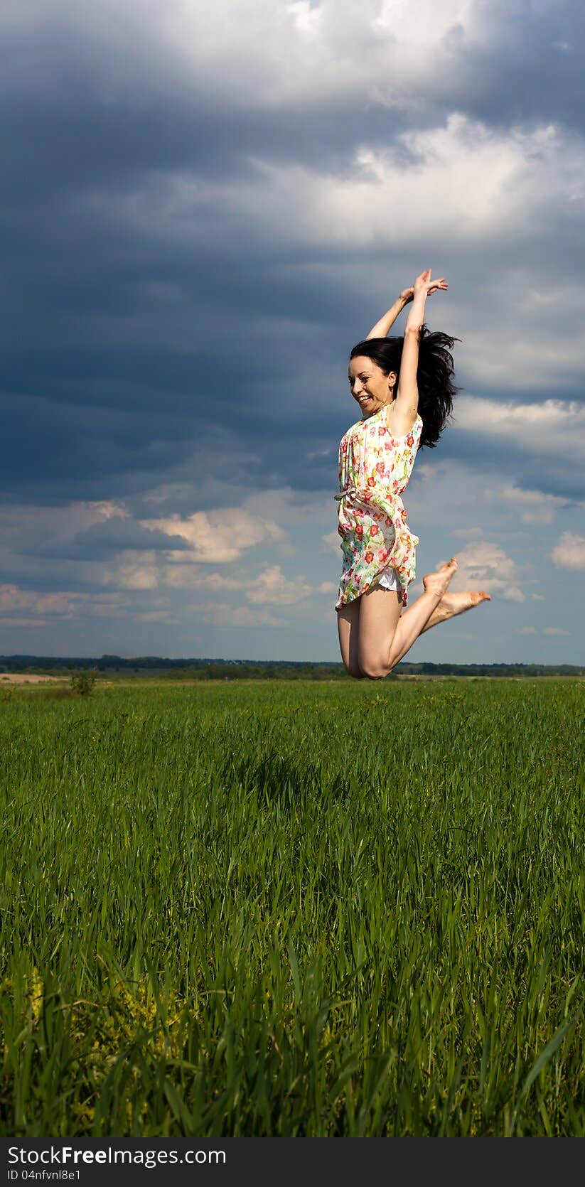 Young Girl Jumping On The Field