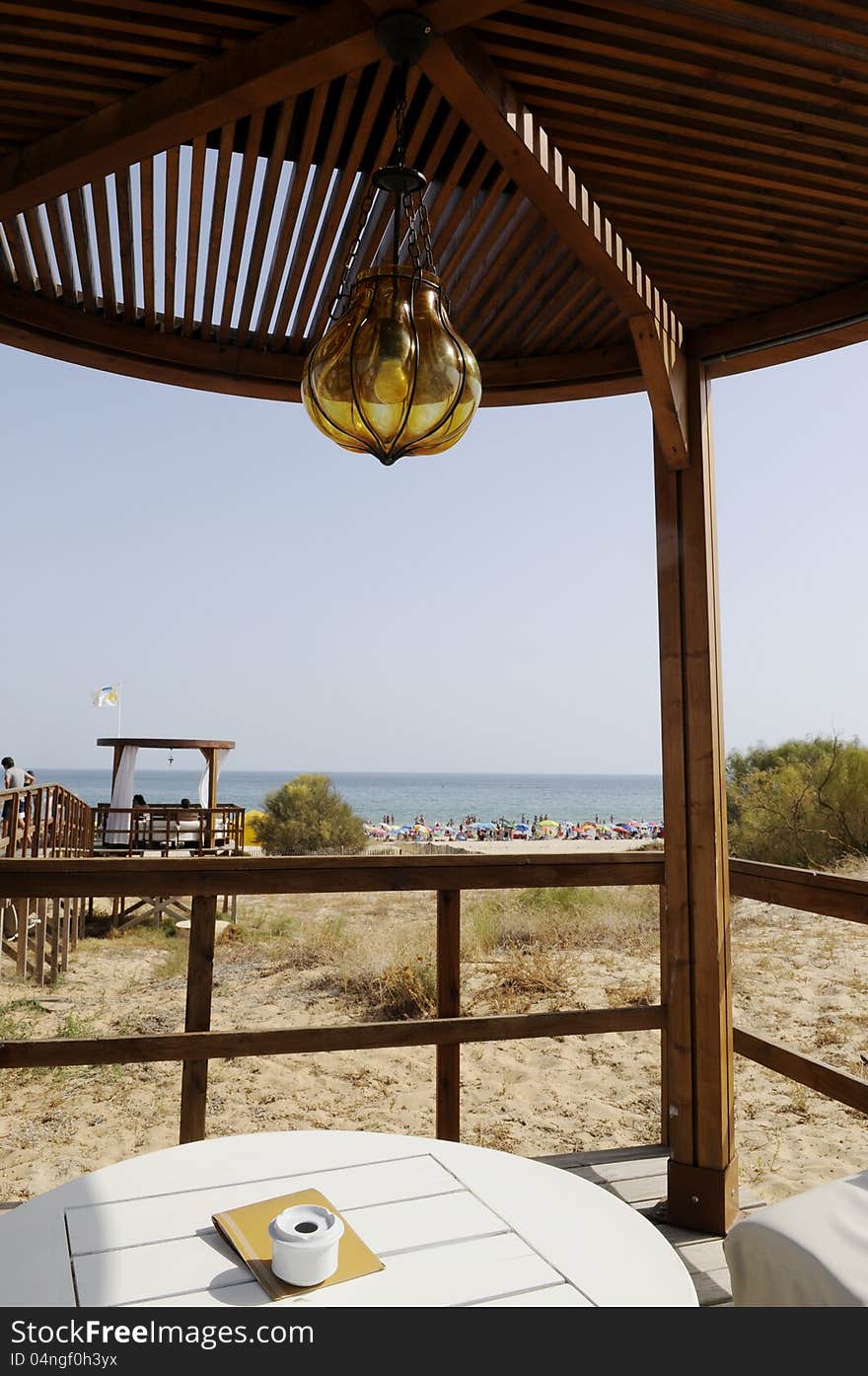 Wooden gazebo at beach with view over the sea, Algarve, Portugal. Wooden gazebo at beach with view over the sea, Algarve, Portugal.