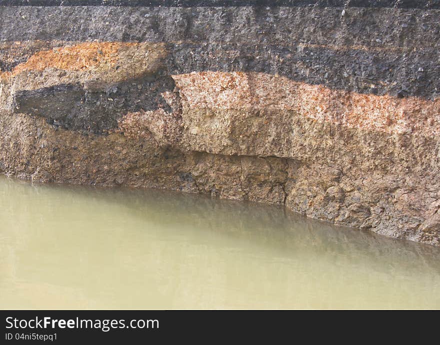 Layer of soil under the asphalt which was eroded by the massive flooding. Layer of soil under the asphalt which was eroded by the massive flooding.