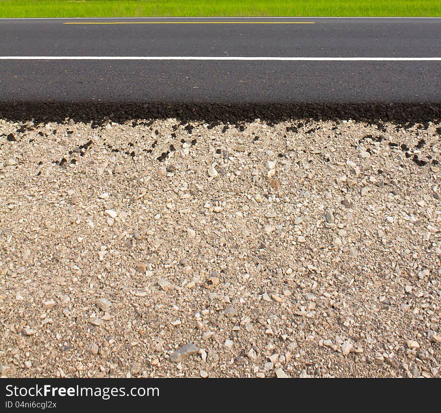 Rock and soil material on the new paved road in the rural areas. Rock and soil material on the new paved road in the rural areas.