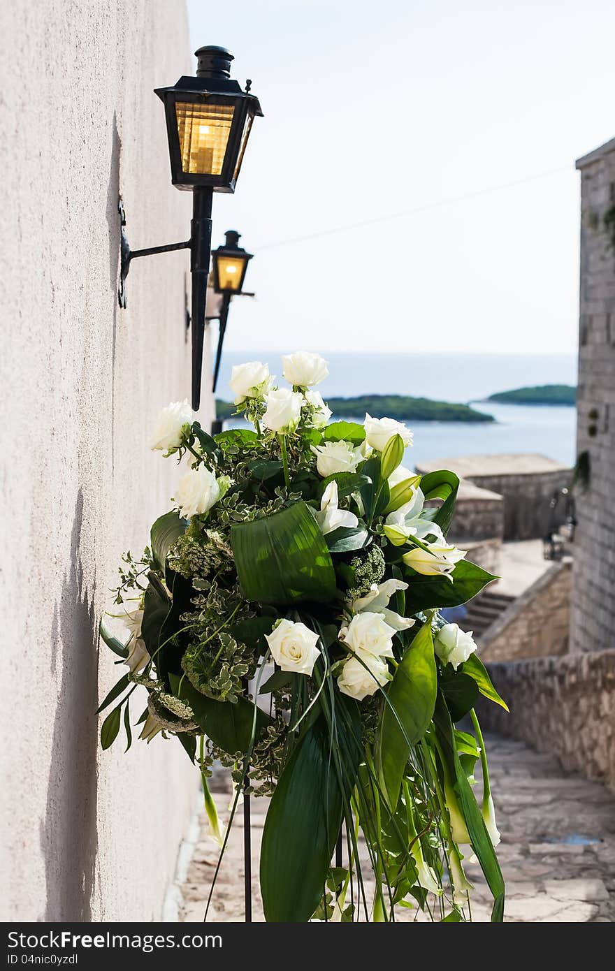 Bouquet of flowers are standing in the street. Bouquet of flowers are standing in the street.