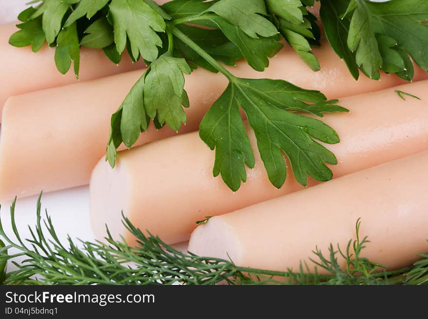 Fresh sausages on a white plate