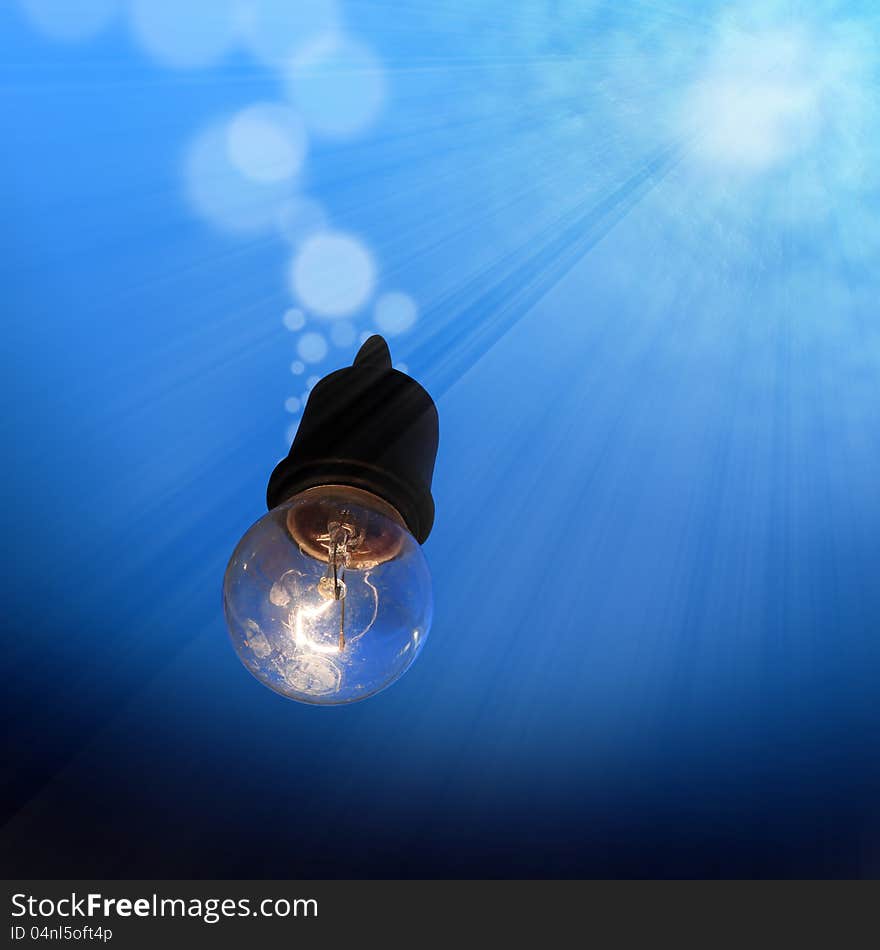 Light bulb underwater with bubble and shinning light