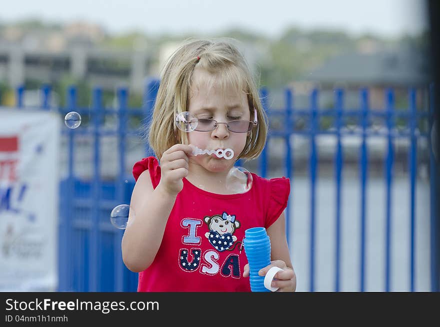 Girl blowing bubbles