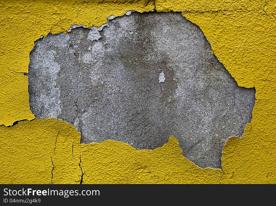 Old wall with dirty broken weathered yellow paint. Old wall with dirty broken weathered yellow paint