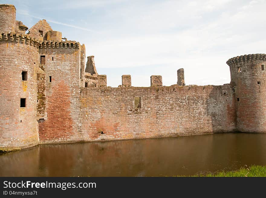 The castle at caerloaverock in 
dumfrieshire in scotland. The castle at caerloaverock in 
dumfrieshire in scotland