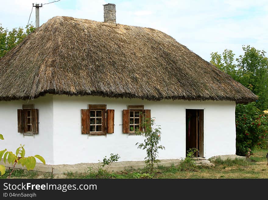 Ukrainian village house with a thatched roof