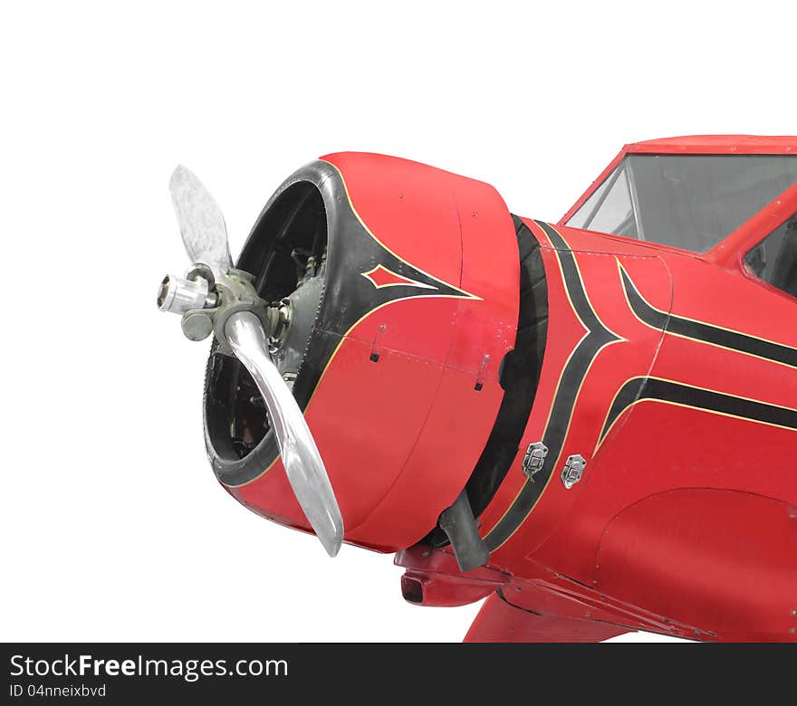 :  Front of a vintage red small airplane isolate.