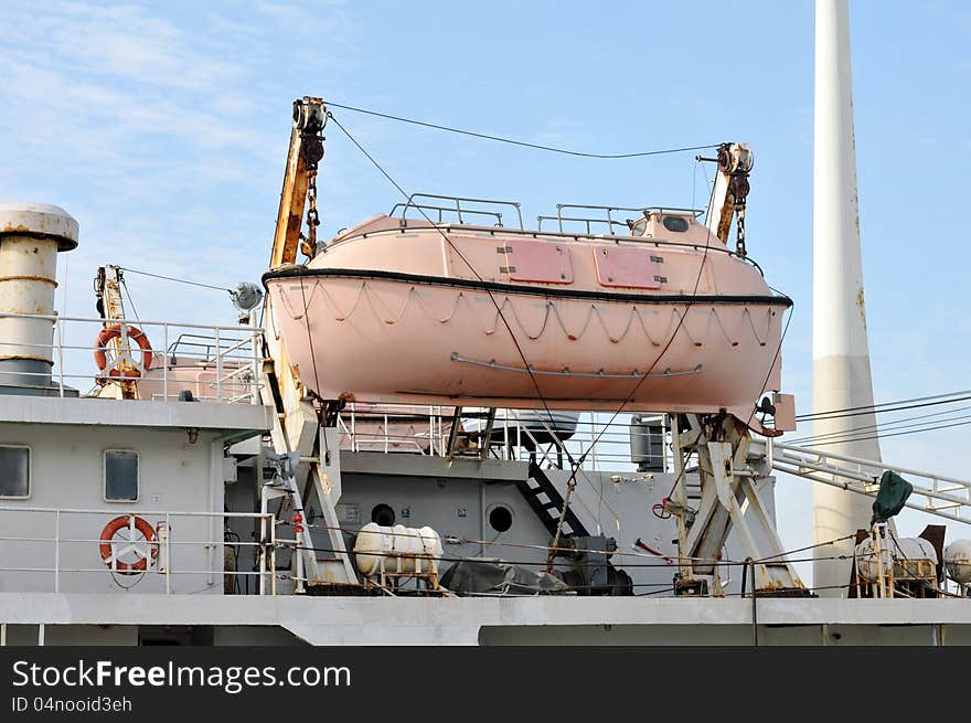 Lifeboat on the ship, which docked at the pier