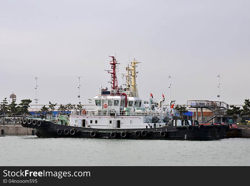 Tugboats parked on the pier