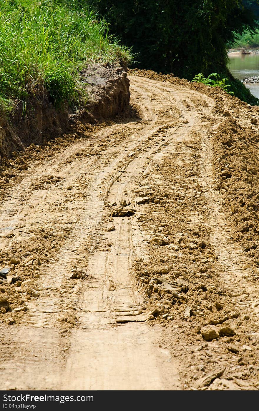 The road has been damaged by flooding. The road has been damaged by flooding.