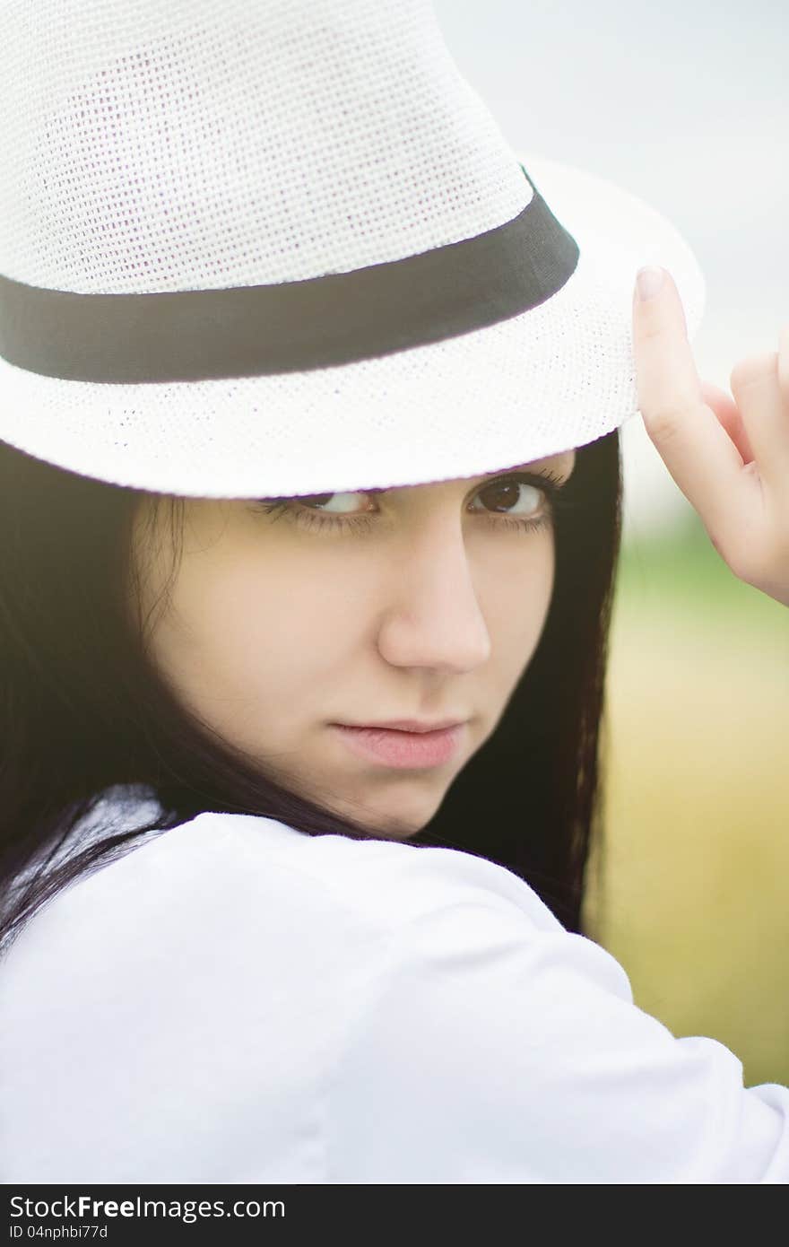 Young Woman Wearing Summer Straw Hat