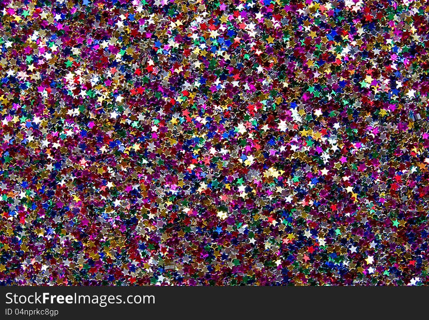 Close up a background from multi-coloured stars. Close up a background from multi-coloured stars.