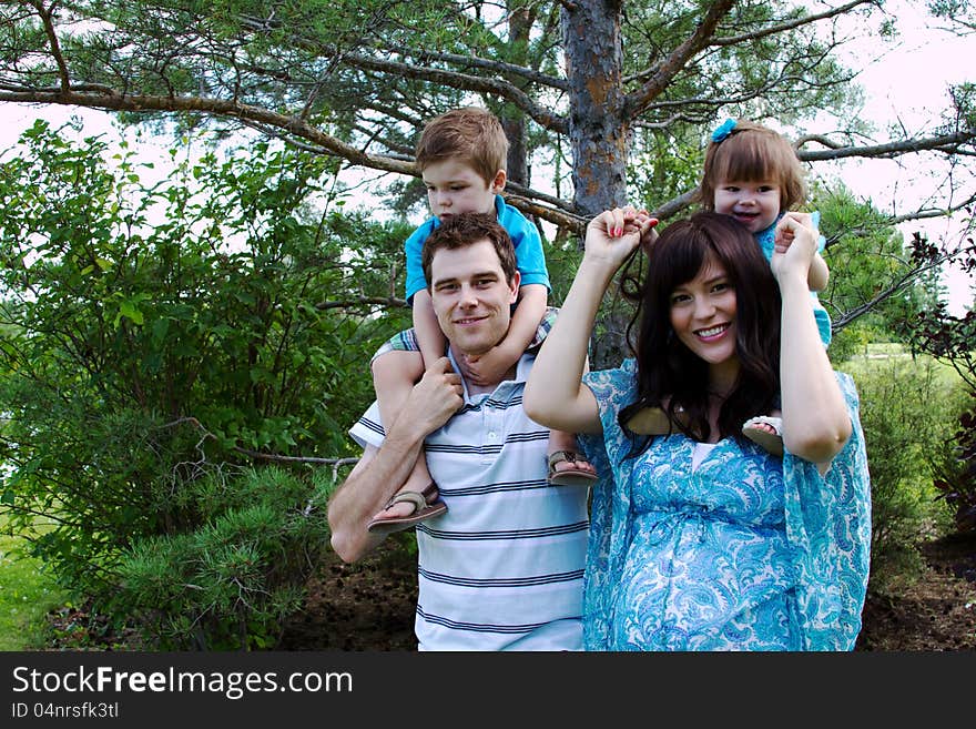 Family Of Four In Park