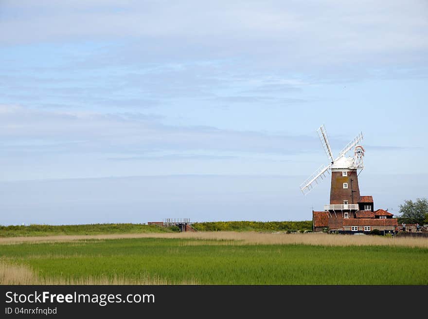 Windmill across marshes at Cley, Norfolk. Windmill across marshes at Cley, Norfolk