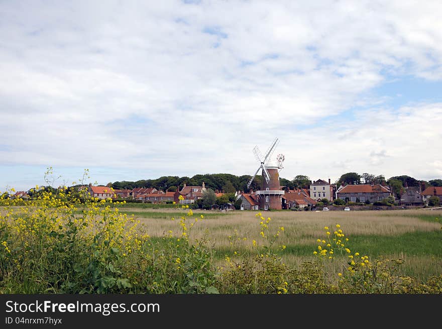 Windmill across marshes at Cley, Norfolk. Windmill across marshes at Cley, Norfolk