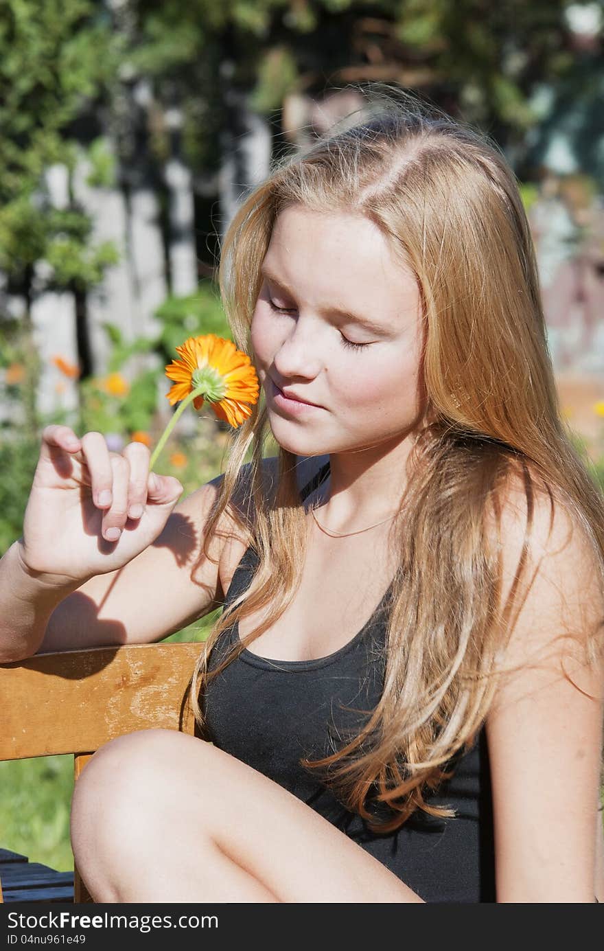 Girl on the meadow in summer day