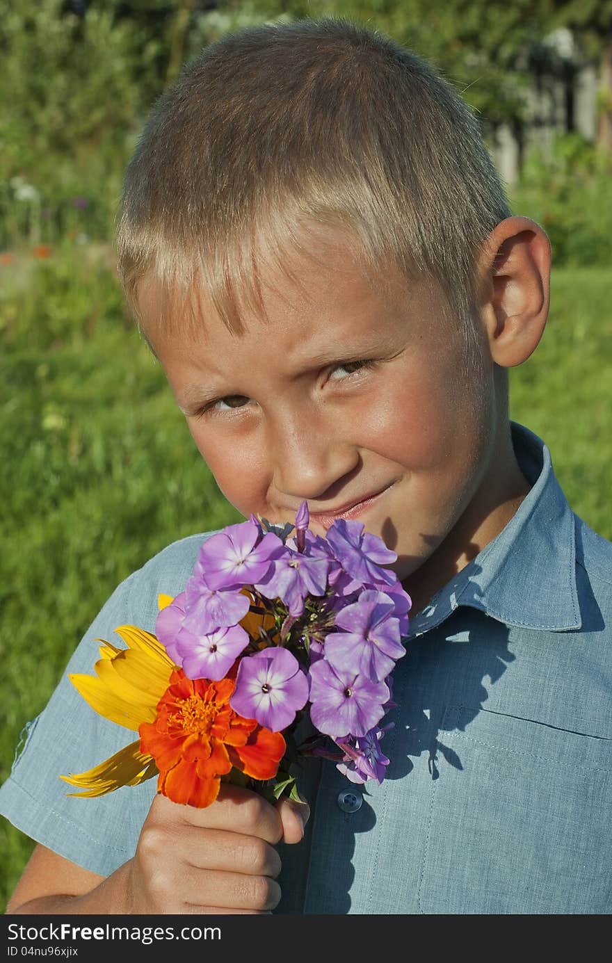 The boy with a bouquet of flowers