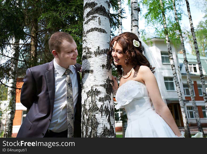 Happy Bride And Groom Near Birch