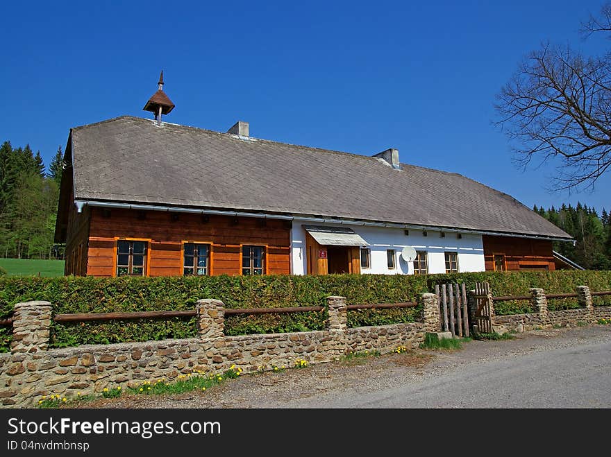 Very nice cottage on a secluded and blue sky in the background. Very nice cottage on a secluded and blue sky in the background