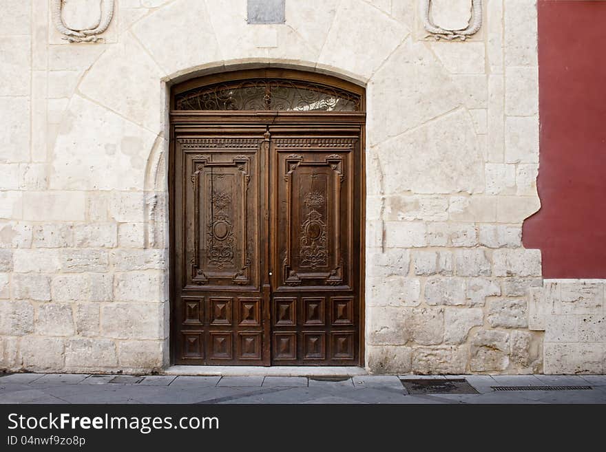 Old wooden entrance door in Valladolid, Castilla y Leon, Spain. Old wooden entrance door in Valladolid, Castilla y Leon, Spain