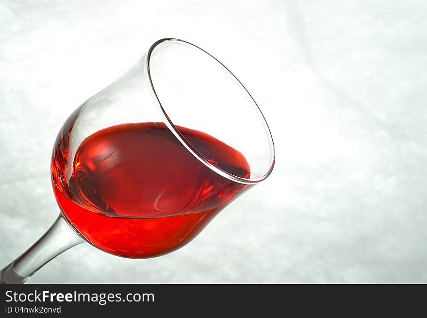 Glasses filled with red on a white background. Glasses filled with red on a white background