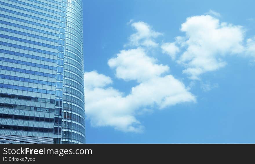 Huge skyscraper fragment with cloudy sky background. Huge skyscraper fragment with cloudy sky background