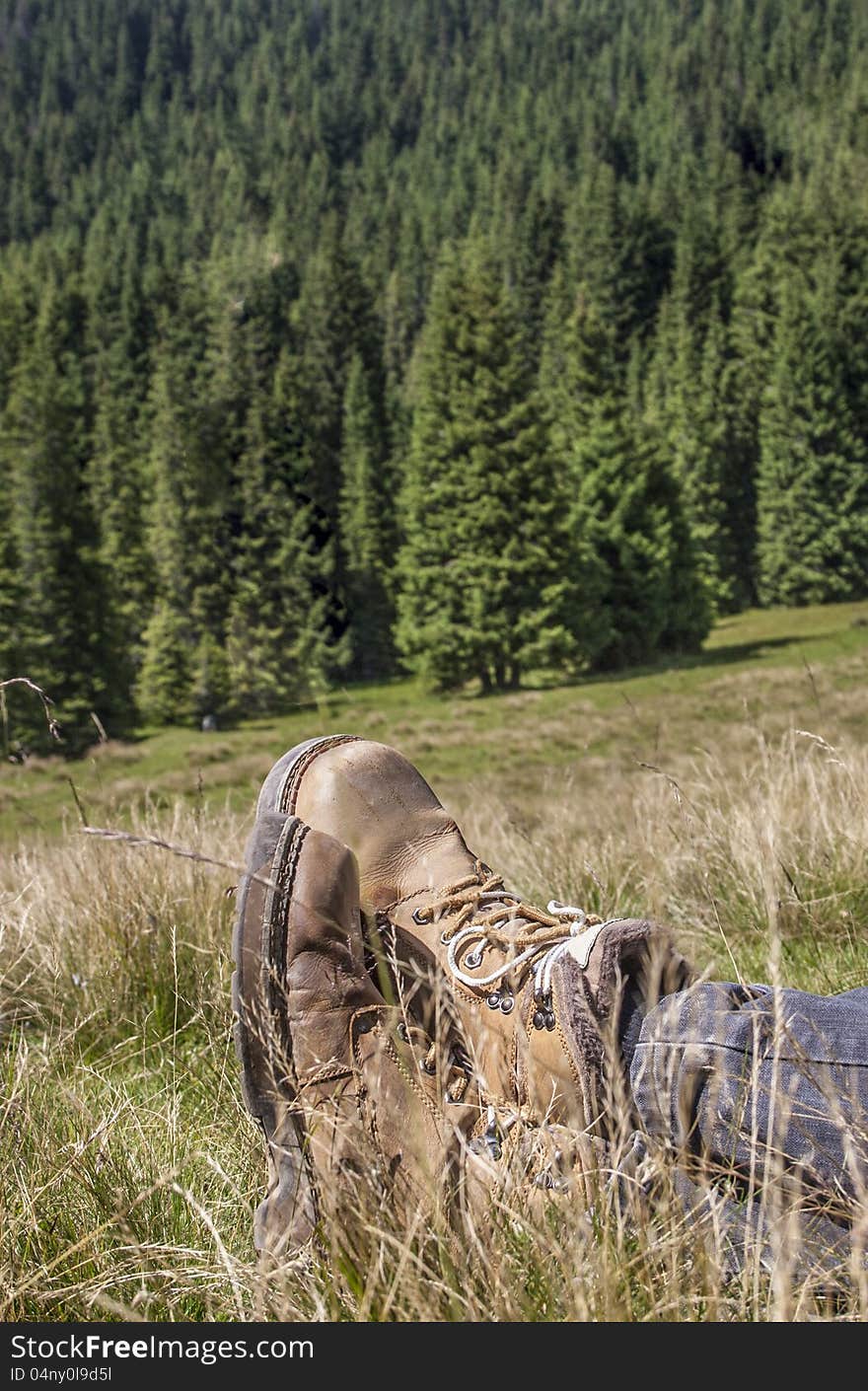 Man resting in a beautiful mountain landscape. Man resting in a beautiful mountain landscape.