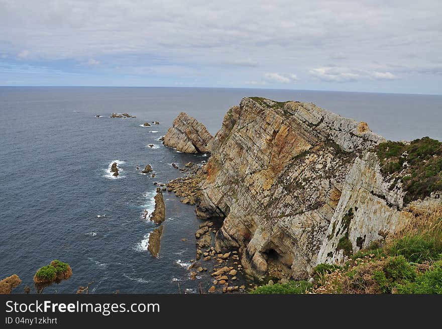 Cabo Penas. Rocky outcrop and cliff. Asturias, Atlantic Ocean, north Spanish coast. Cabo Penas. Rocky outcrop and cliff. Asturias, Atlantic Ocean, north Spanish coast.