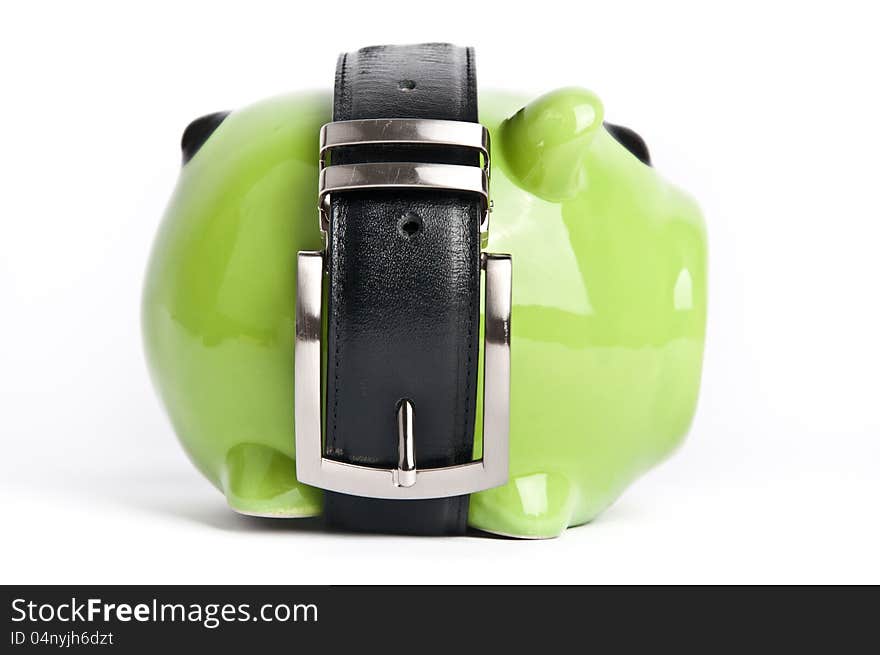 Green piggy bank with black belt around. Green piggy bank with black belt around