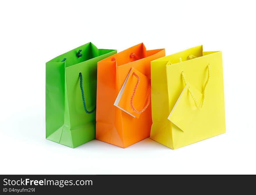 Green, Orange and Yellow Shopping Bags isolated on white background