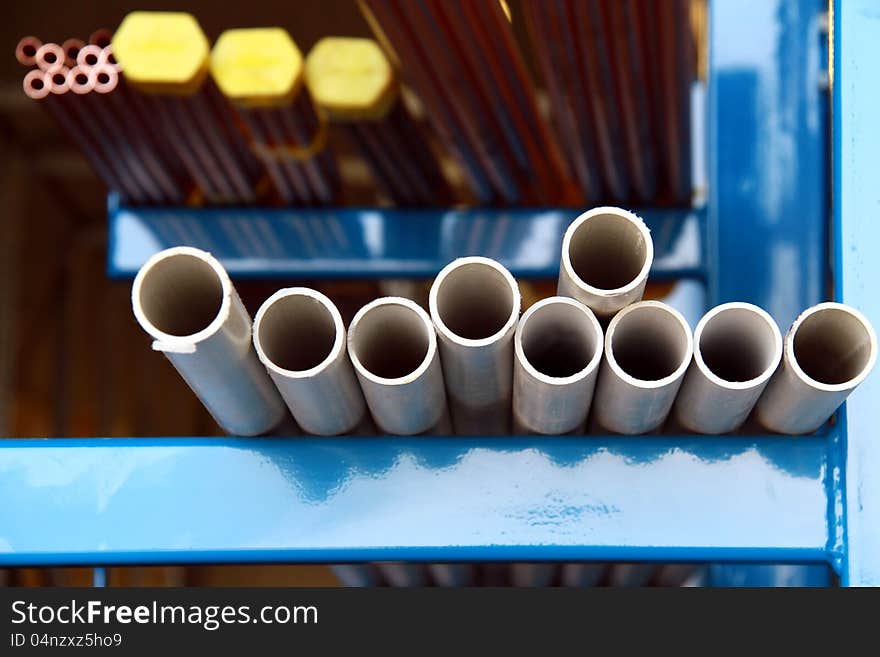 Image of heavy iron piping sitting on a shelve. Image of heavy iron piping sitting on a shelve