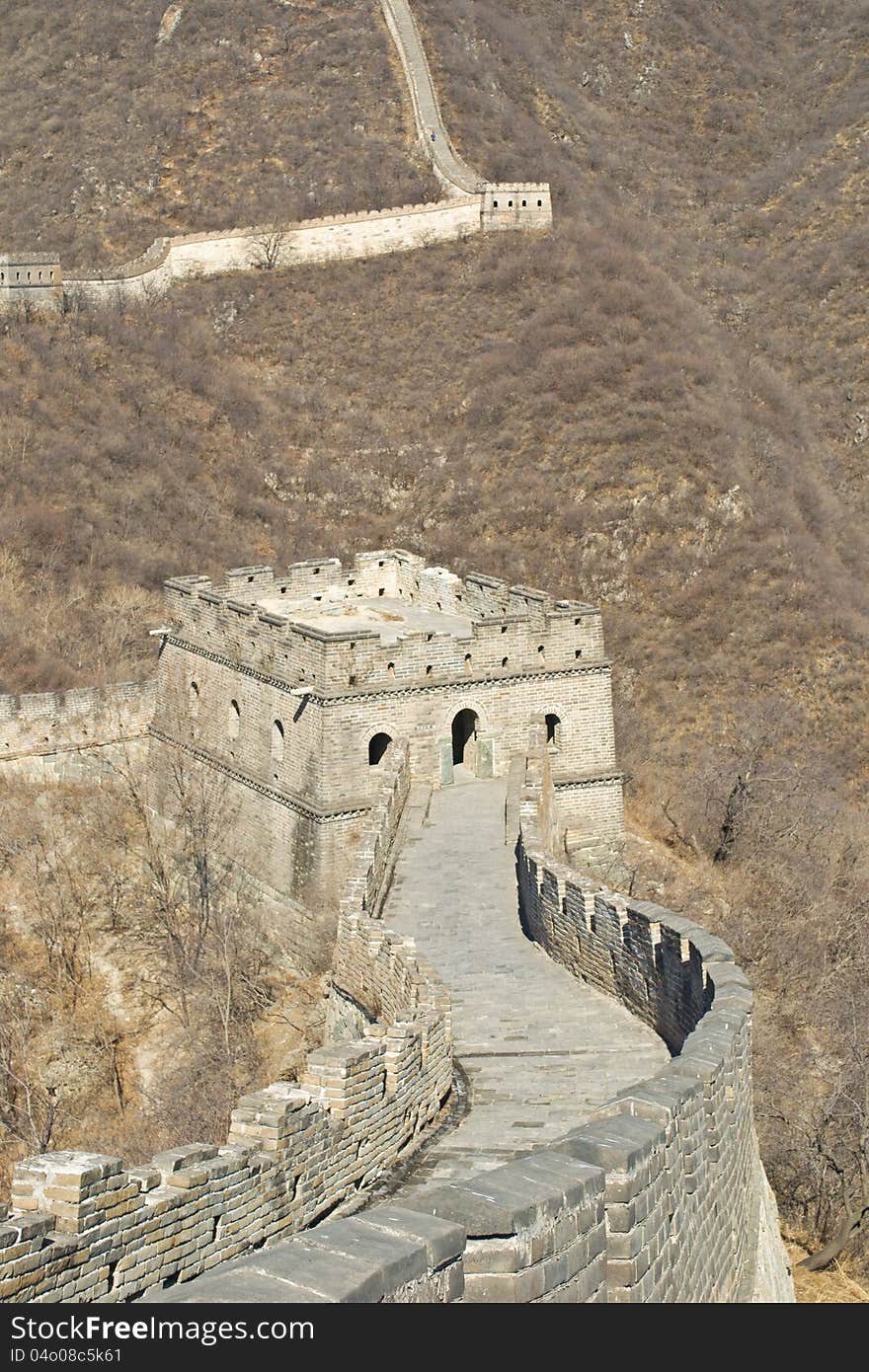 Close of: Great Wall of China, snaking across the mountainous landscape and a great tower