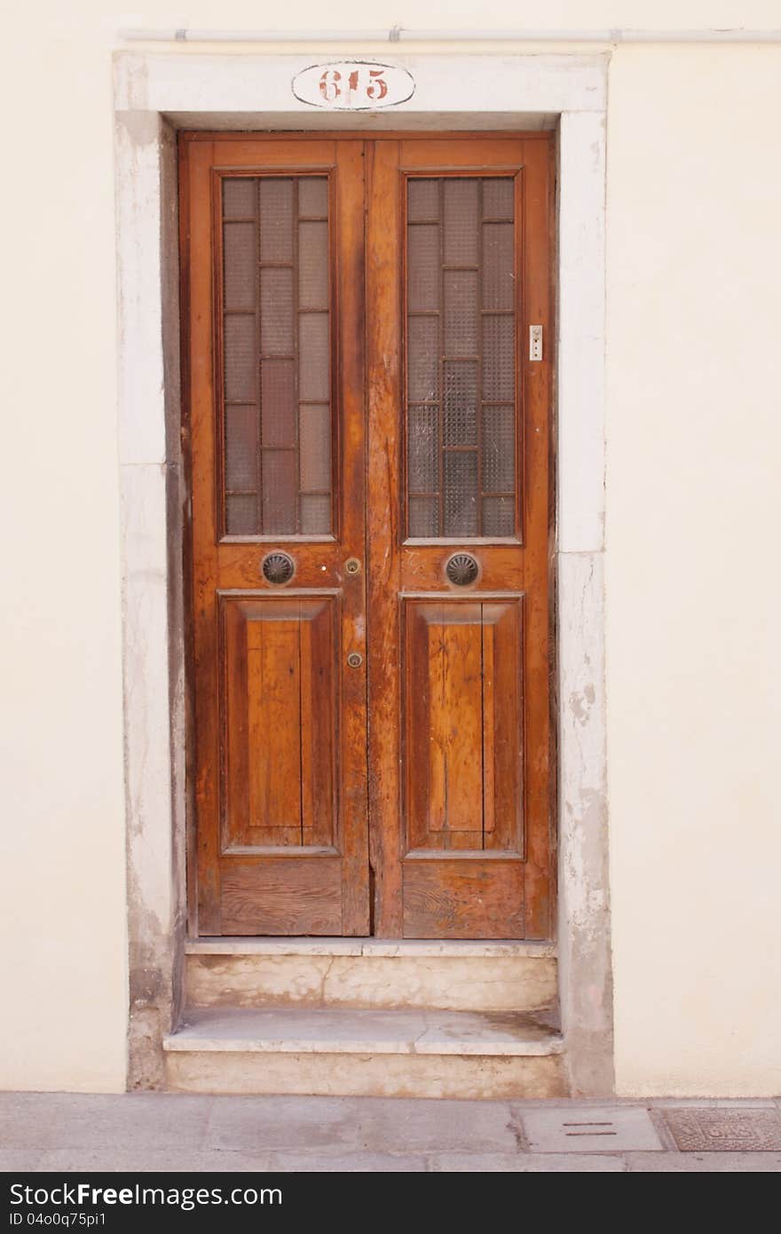 Old closed door in Venice, Italy.