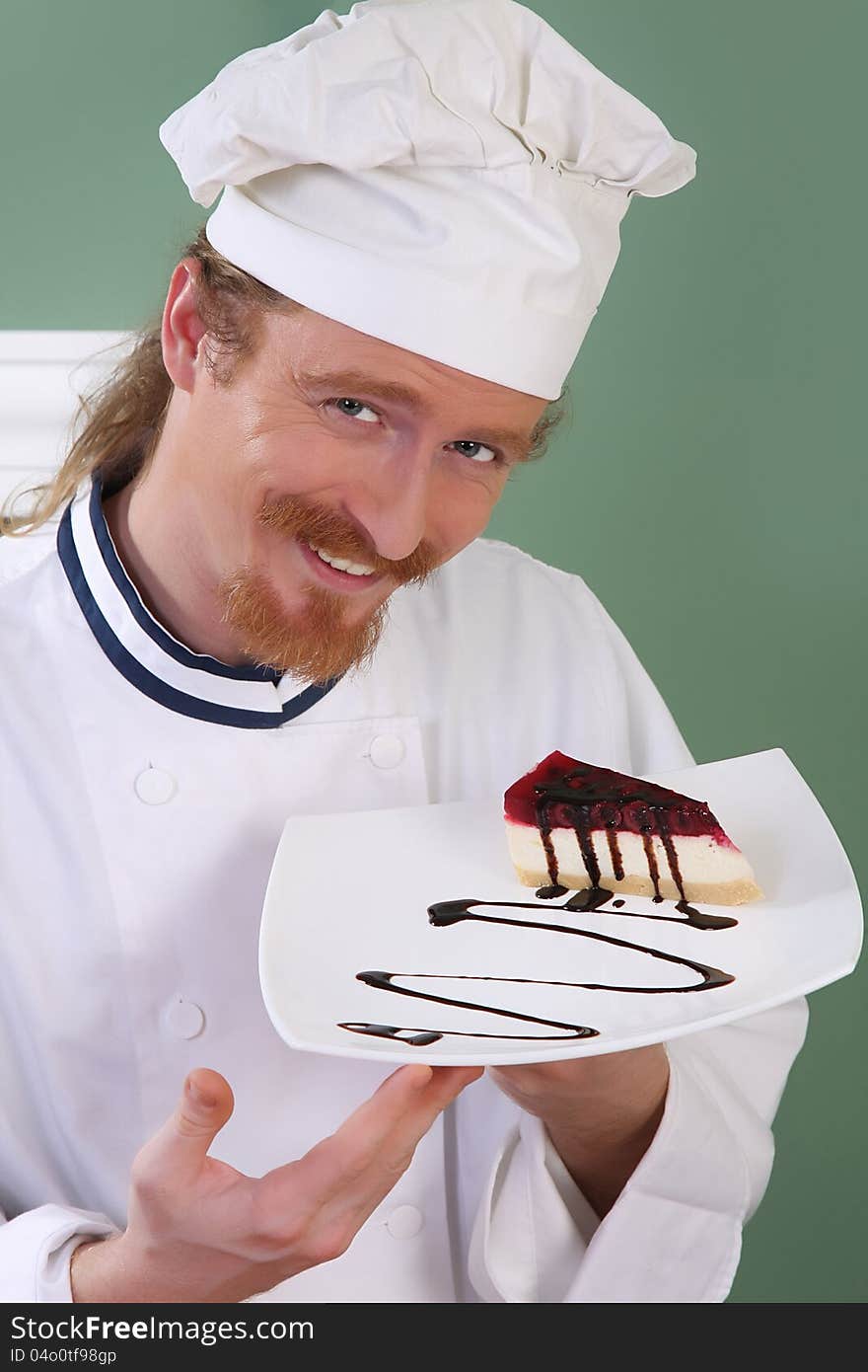 Young Chef With Piece Of Cake