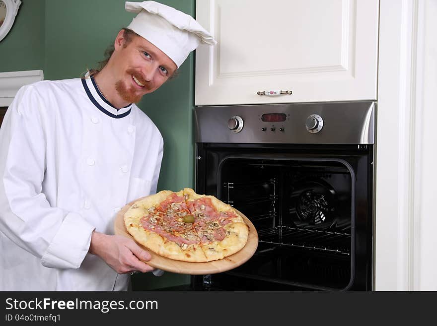 Young Chef With Italian Pizza