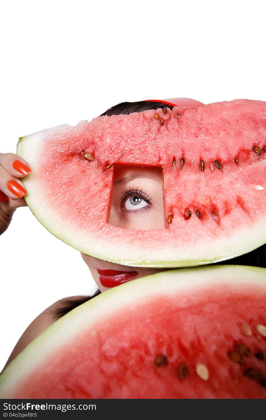 Her look through a hole in a watermelon