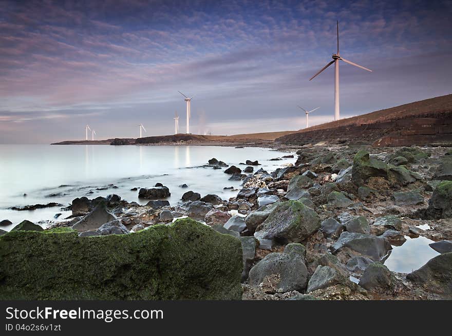 Workington Coastal Wind Farm captured while the sun was setting on a winter evening. Workington Coastal Wind Farm captured while the sun was setting on a winter evening.