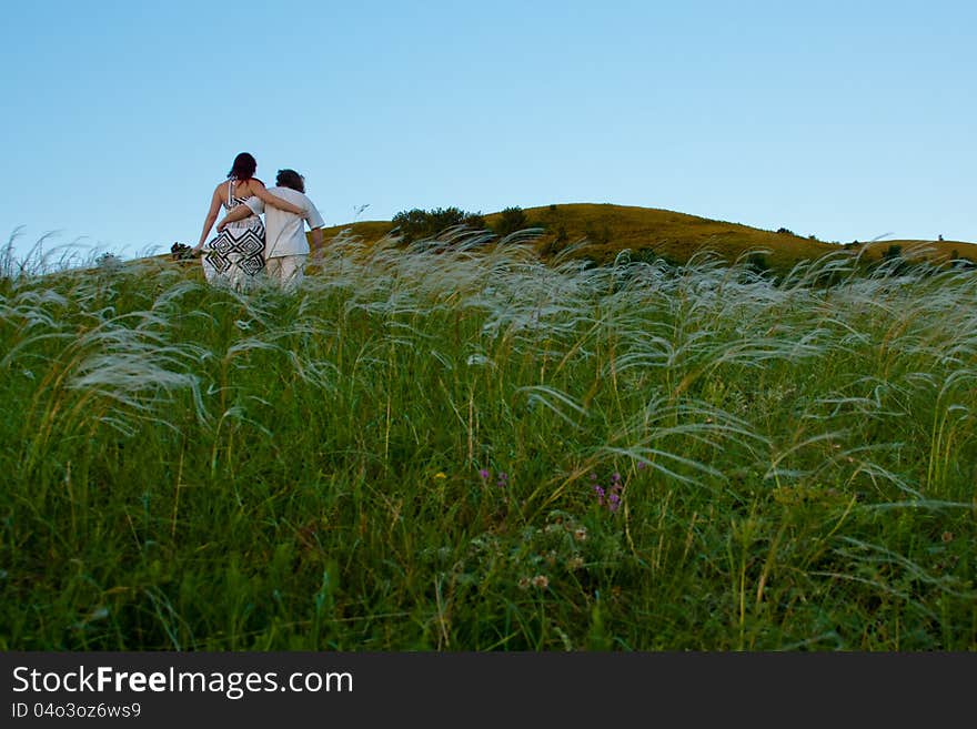 Young man and woman on the mountain.