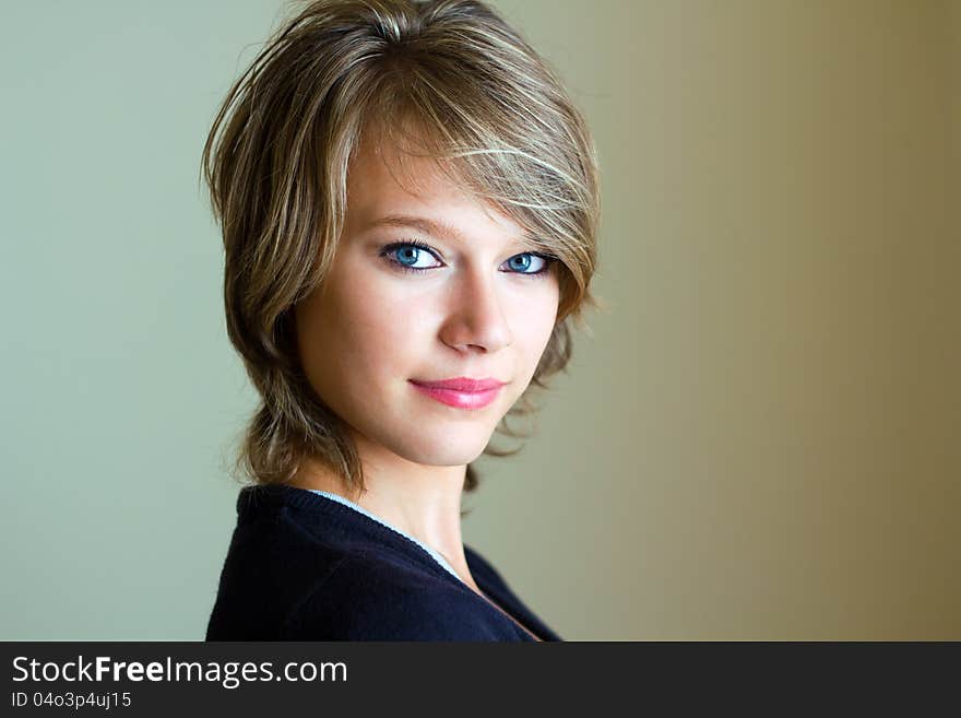 Portrait of happy young woman at home. Portrait of happy young woman at home