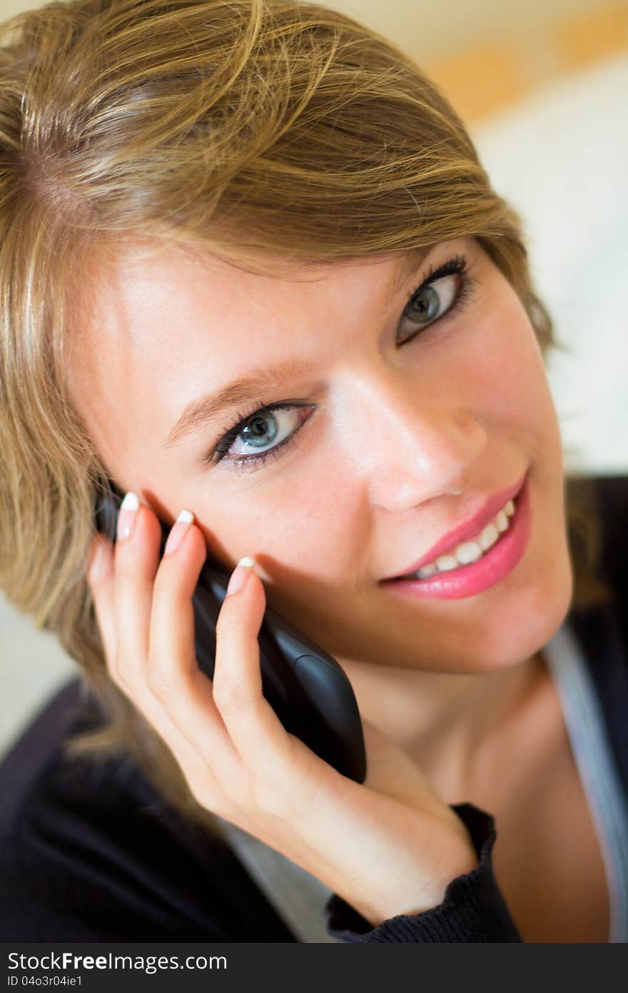 Blonde Woman With Mobile At Home