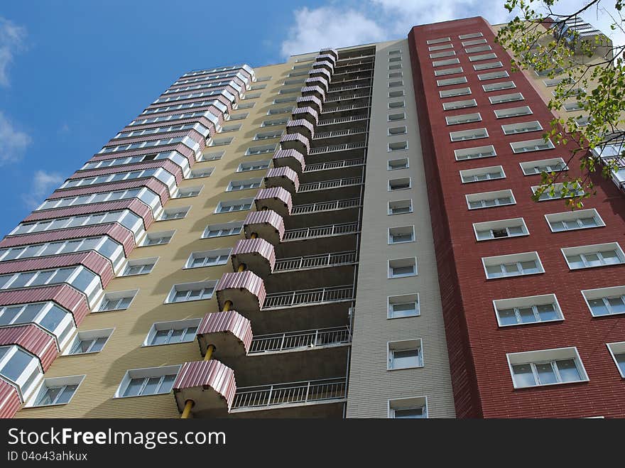 Multistorey building against a background with blue sky