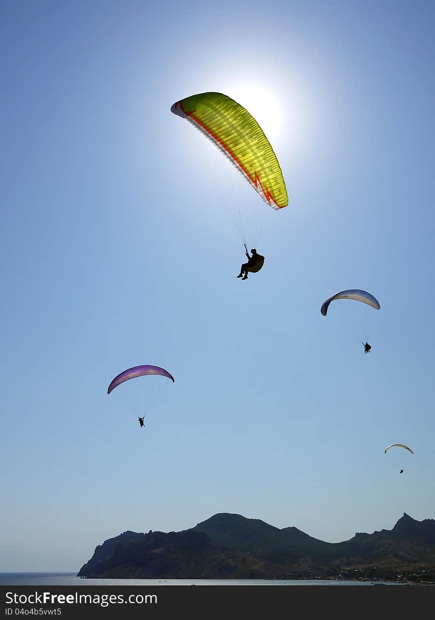 Paragliding in the blue sky