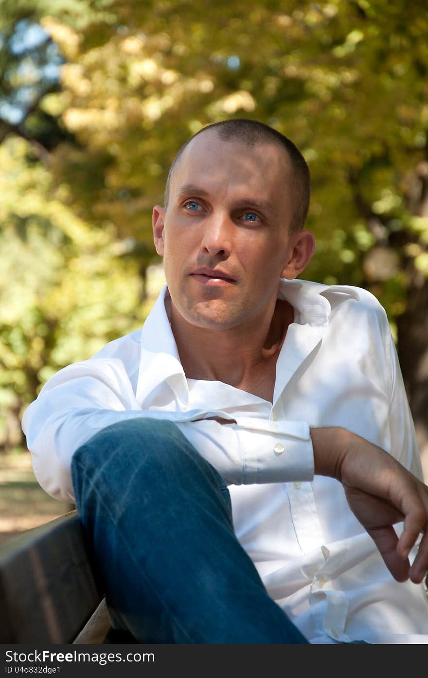 Portrait of a young man in the park